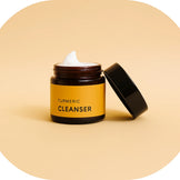 AMVital Turmeric Cleanser jar with open lid – gentle foaming cleanser for brightening and clear skin