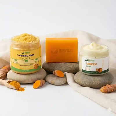 Turmeric body scrub, cream, and soap with turmeric roots and powder on a light background