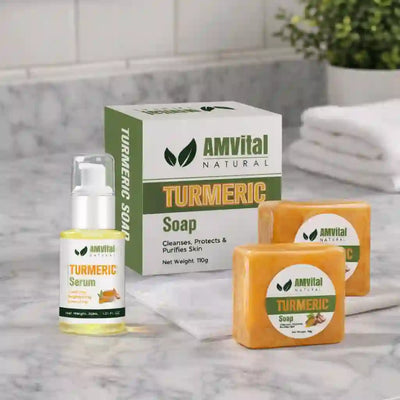 AMVital Turmeric skincare products including soap and serum on a bathroom counter.