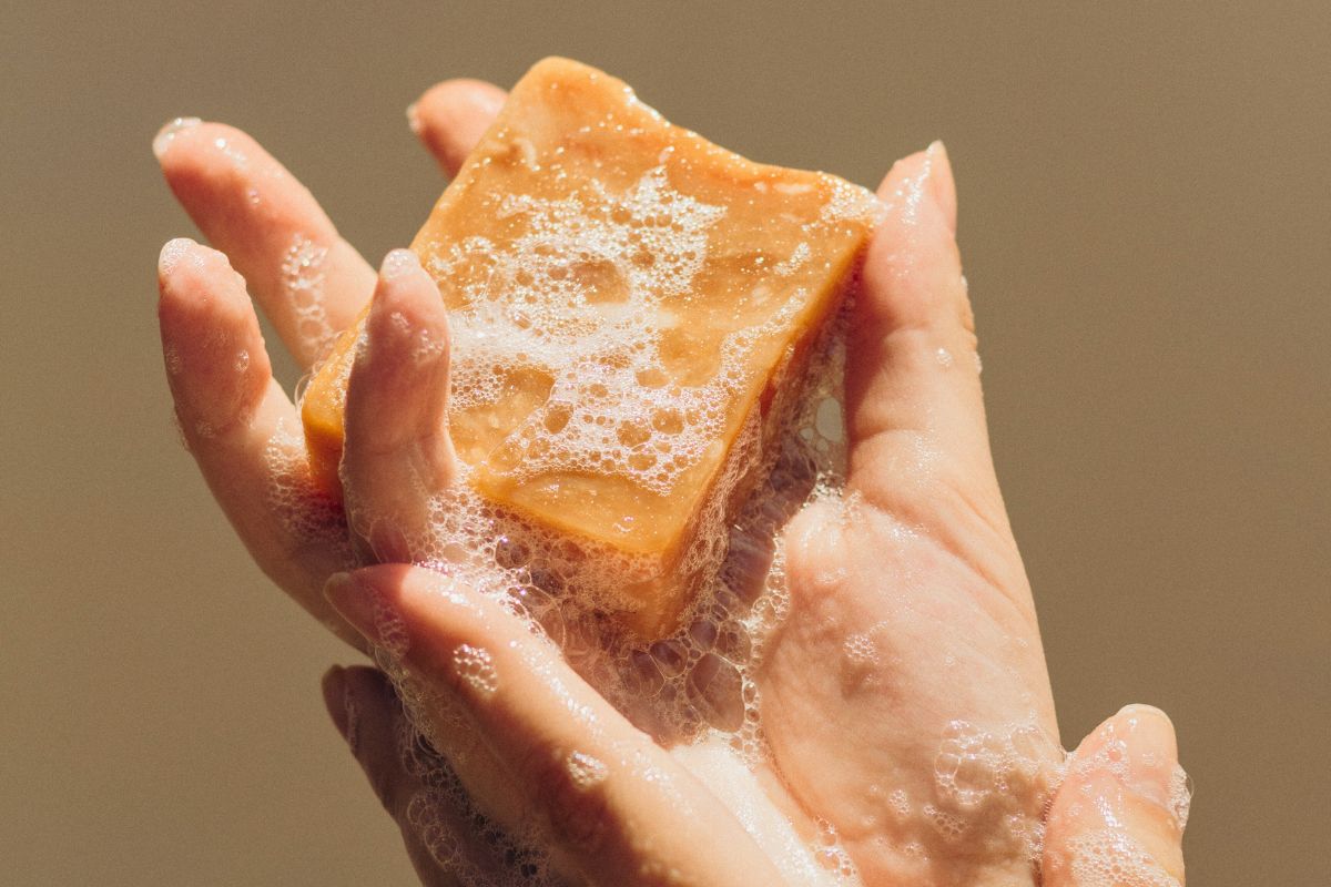 The woman uses bar soap.