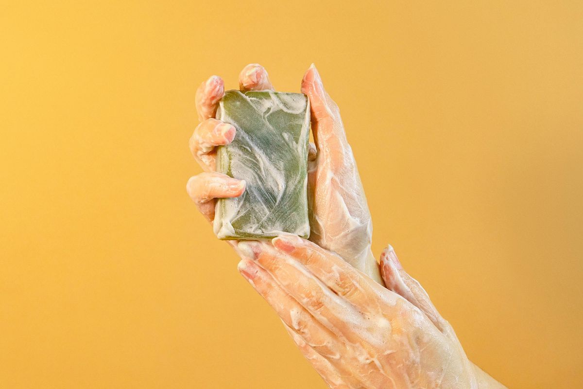 The woman is using a pH-balanced soap.