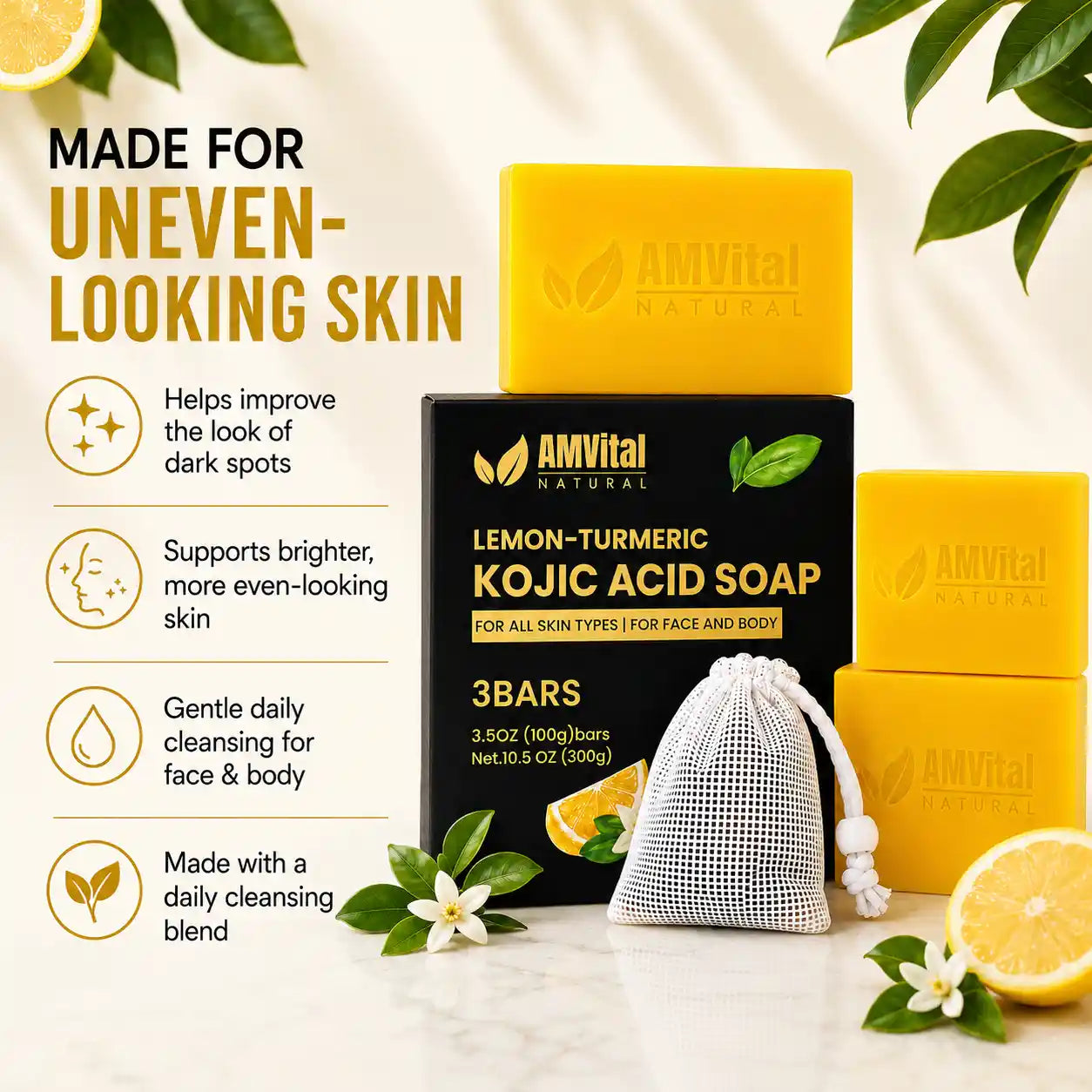 Three AMVital Natural lemon-turmeric kojic acid soap bars with a black box and a mesh soap bag, styled with lemon slices, white flowers, and green leaves on a light marble surface with text overlays on the left.