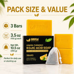Three bars of AMVital Natural lemon-turmeric kojic acid soap displayed with their black and yellow packaging box and a white mesh drawstring bag