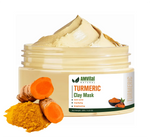 AMVital Turmeric Clay Mask with turmeric root and powder on a white background