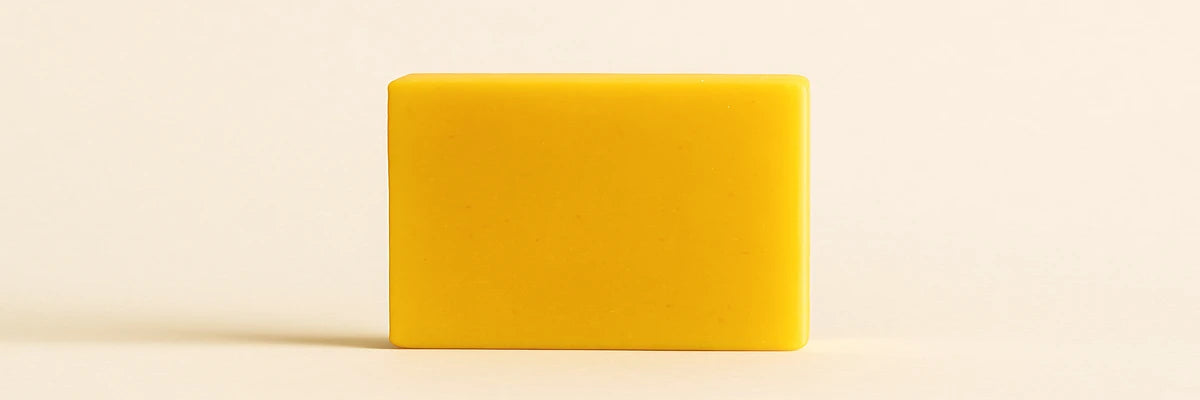 AMVital Turmeric Kojic Acid Soap product facts displayed with bar image, key ingredients, routine fit, and skin type guidance on a beige background