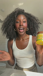 Woman demonstrating AMVital Turmeric & Kojic Acid Exfoliating Cleansing Pads as a one-step routine to cleanse, exfoliate and brighten