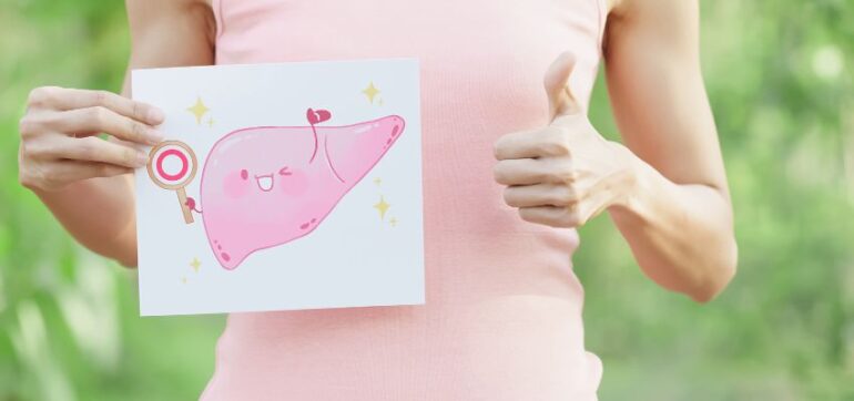 The woman shows a picture of a healthy liver.