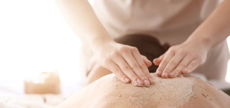 The staff from the med spa applied body scrubs to the client's back because they have many skin benefits.