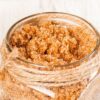 A jar of brown sugar body scrub.