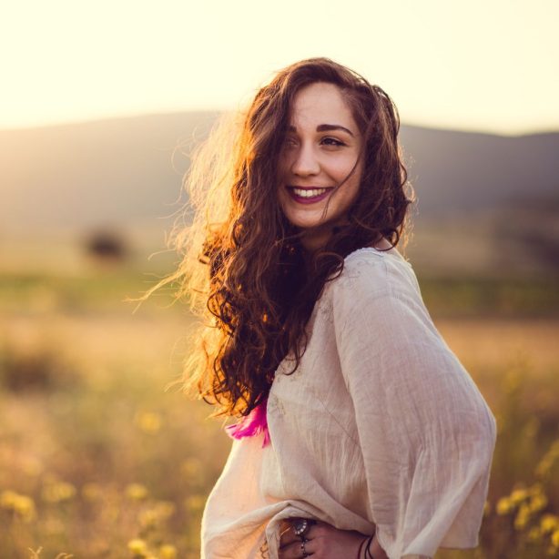 A vibrant healthy woman taking turmeric based products by AMVital.