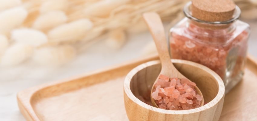 A woman eating sweet foods to get rid of salty taste in mouth.