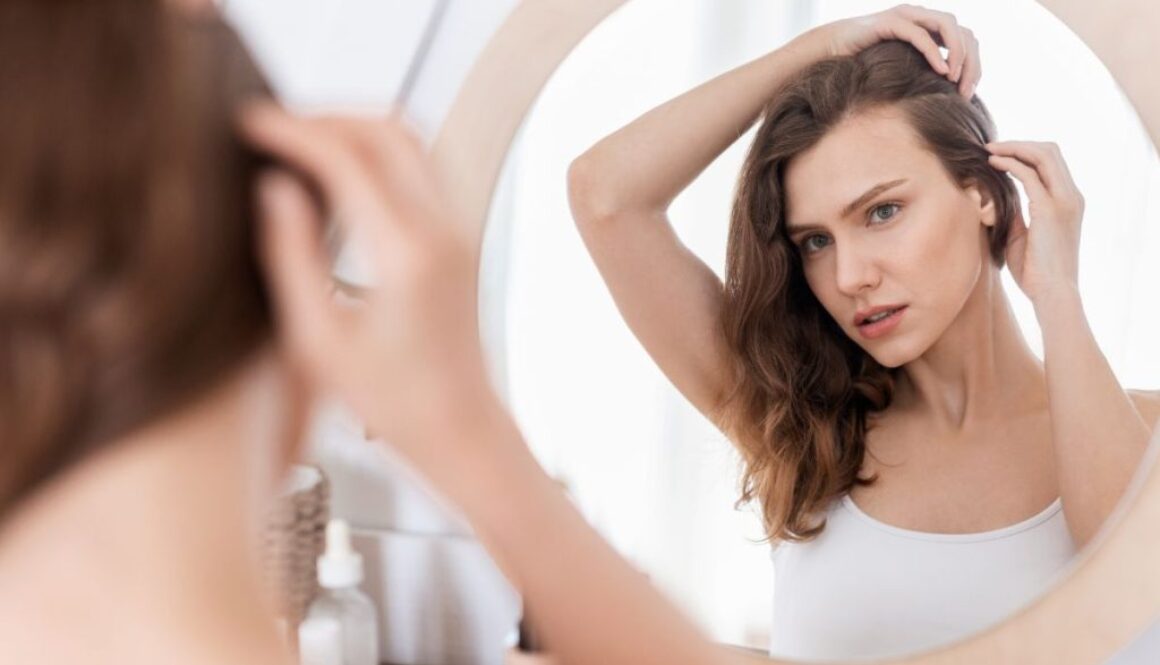 The woman is not satisfied with her hair growth.