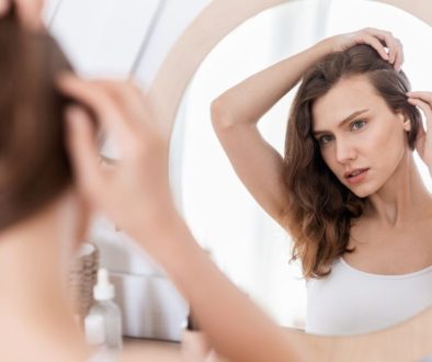 The woman is not satisfied with her hair growth.