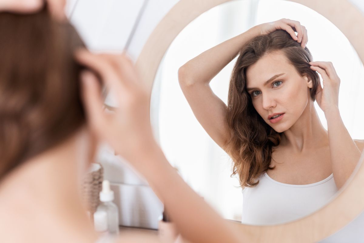 The woman is not satisfied with her hair growth.