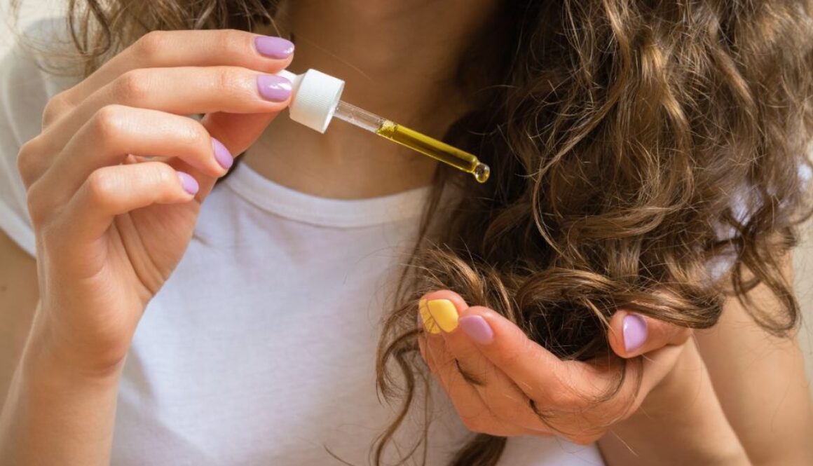 The woman uses organic hair oil.