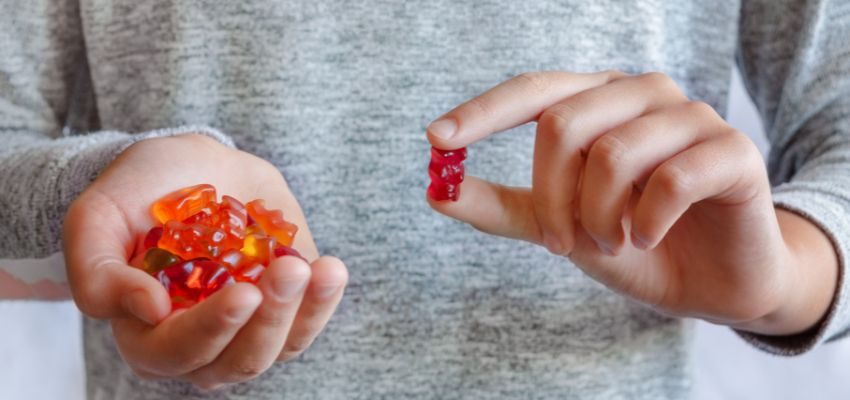 A woman eating sweet foods to get rid of salty taste in mouth.