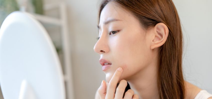 A woman eating sweet foods to get rid of salty taste in mouth.