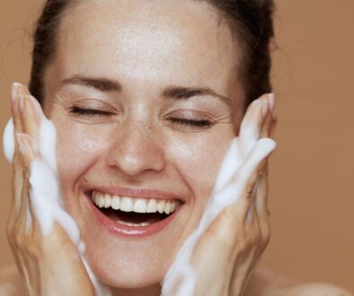 The woman was happily cleansing her face.