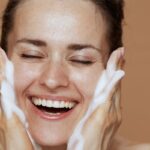 The woman was happily cleansing her face.