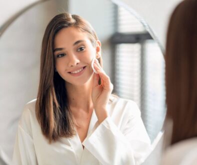 The woman wiped the dirt off her face with turmeric cleansing pads.