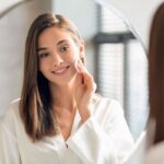 The woman wiped the dirt off her face with turmeric cleansing pads.